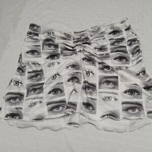 Beautiful short skirt with eye patterns, spandex, stretchy